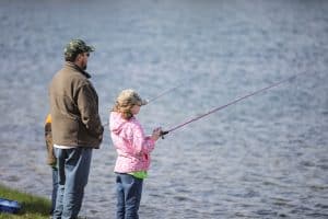 Father and daughter fishing at the Trout Derby in Sylvania