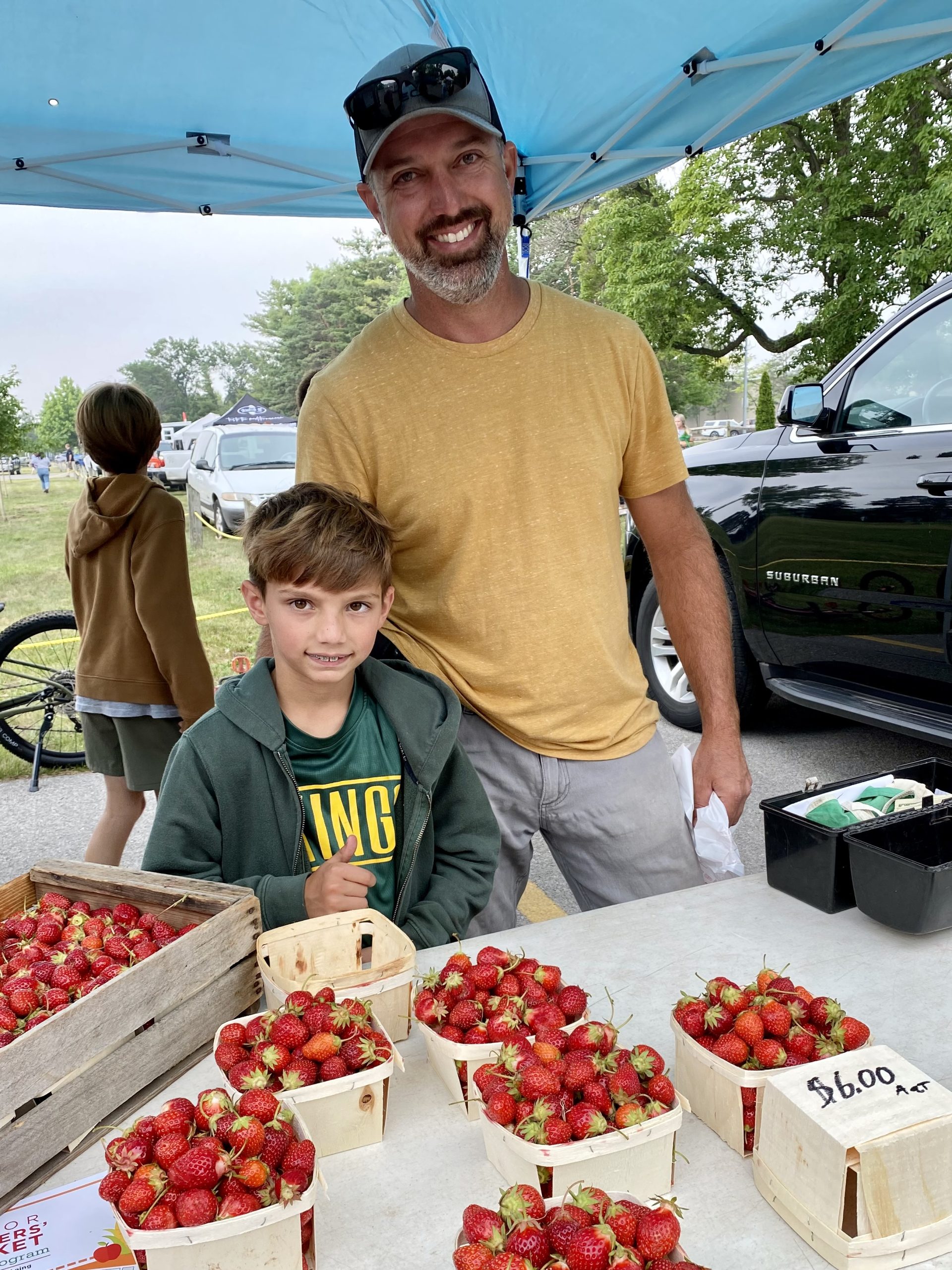 Man and son visiting the farmers market